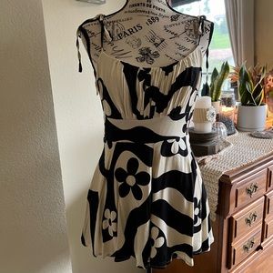 Urban outfitter. black and cream adjustable strap romper. Size M. NWT